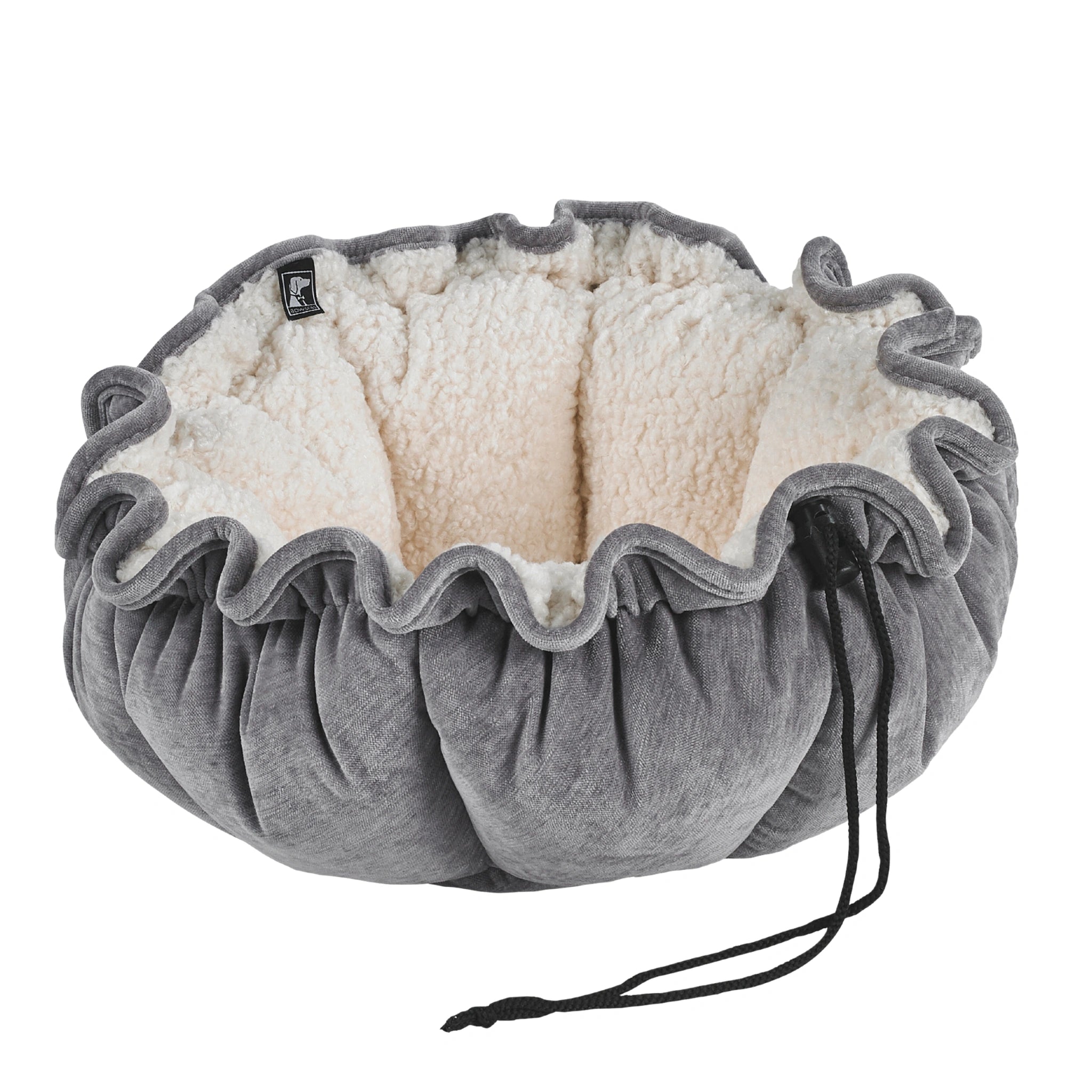 Gray pet bed with fluffy interior on a white background